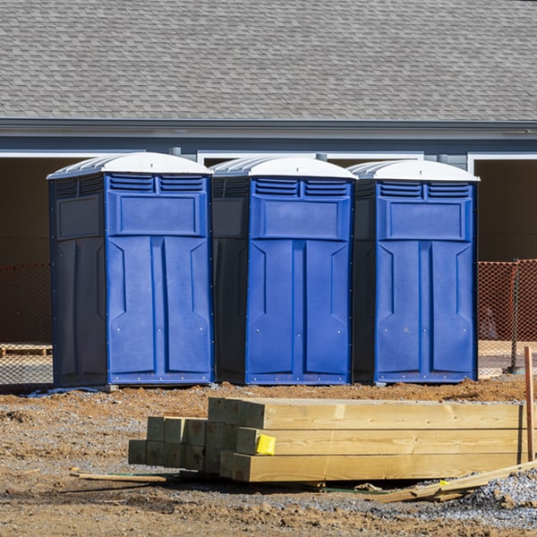 what is the cost difference between standard and deluxe portable restroom rentals in Adah